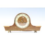 A 1960s Junghans walnut mantle clock, having a two train movement, striking on a gong, 32 x 9 x 17