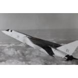 A pair of official photographs of RAF Canberra and TSR2 aircraft, uniformly framed under glass, 51