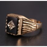 A vintage 9 ct gold signet ring having a black onyx matrix set with a small diamond, R/S, 2.9 g