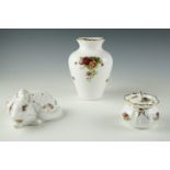 Three items of Royal Albert "Old Country Roses" pattern ceramics, comprising a vase, a bag form