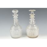 A pair of finely-cut late Georgian glass decanters, of Prussian bodied form with triple neck