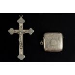 A vintage chrome plated crucifix pendant and an electroplated vesta case, former 11.5 cm high
