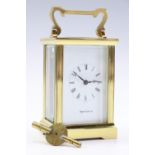 A Mappin & Webb carriage clock, 15 cm with handle raised, (running when catalogued, accuracy and