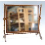 An early 20th Century reproduction mahogany swivel toilet mirror, 55 x 52 cm
