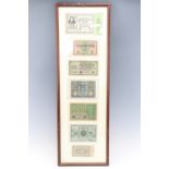 A group of German Weimar hyper inflation and other banknotes, framed under glass, 82 x 27 cm