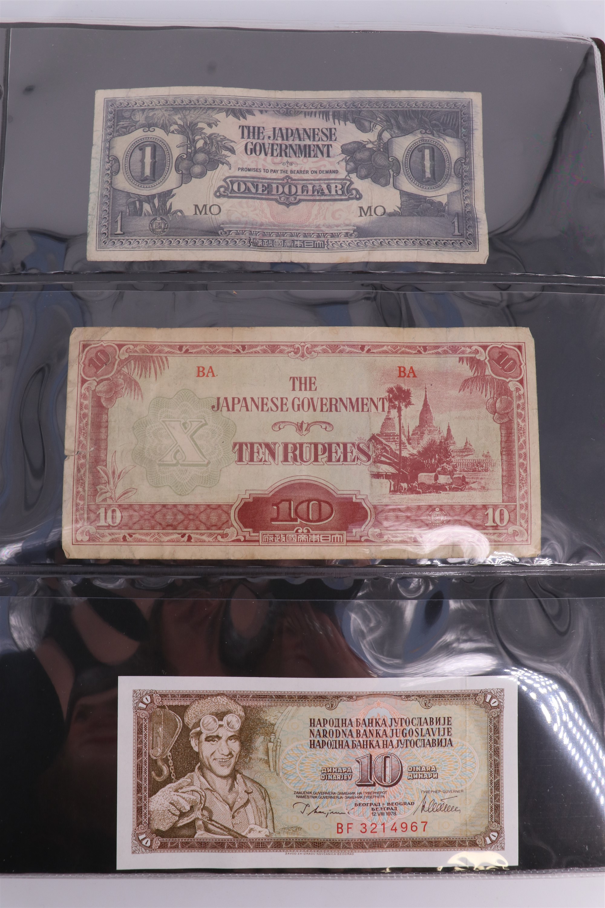 An album containing a collection of world banknotes, including Zaire (DR Congo), Ireland, - Image 36 of 87