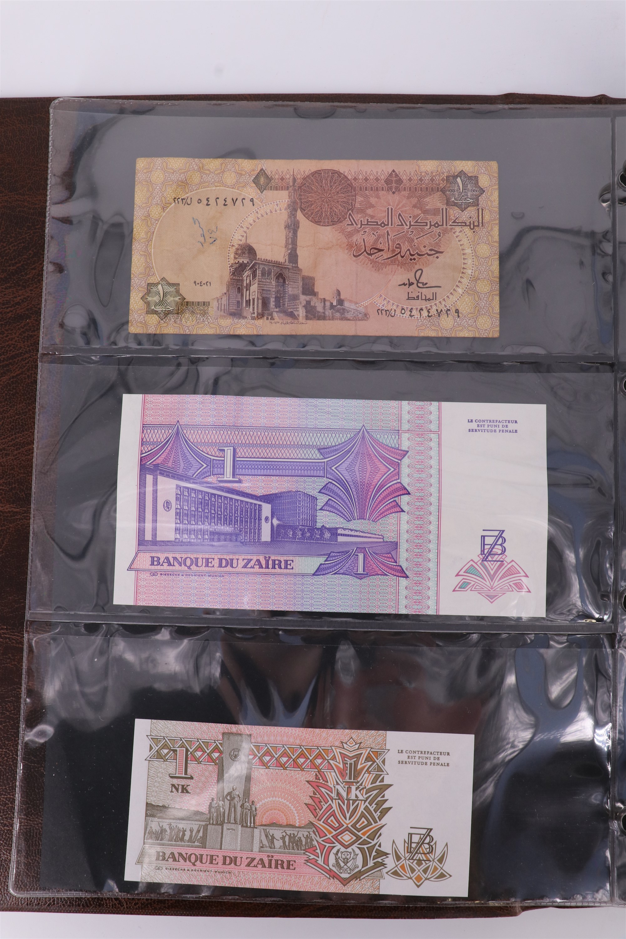 An album containing a collection of world banknotes, including Zaire (DR Congo), Ireland, - Image 3 of 87