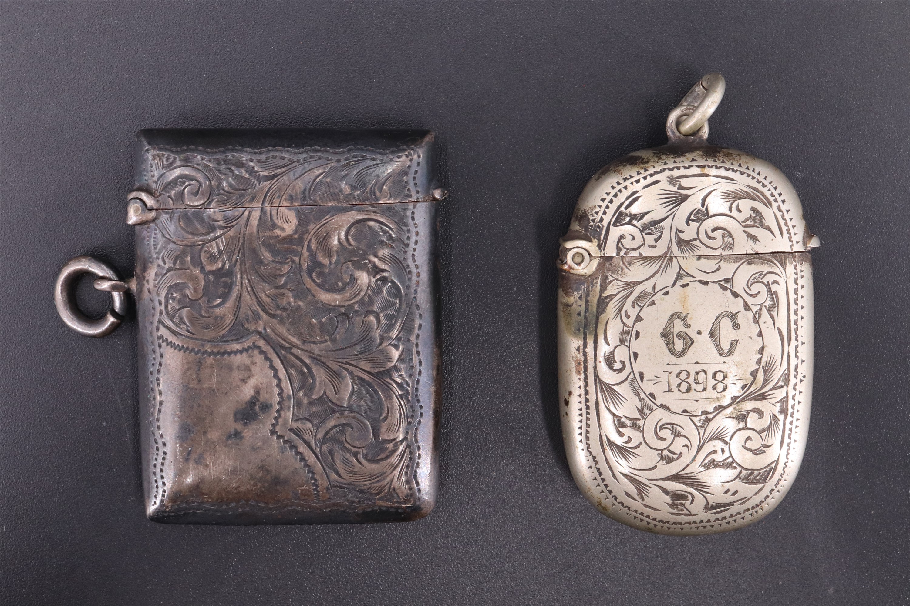 A Victorian silver vesta case, decorated with engraved foliate scrolls, William J Holmes,