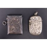 A Victorian silver vesta case, decorated with engraved foliate scrolls, William J Holmes,