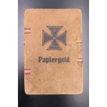 A Great War German printed card banknote wallet, its cover printed in depiction of a 1914 Iron Cross