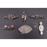 Six various Victorian and later silver / white metal brooches including a Queen Victoria