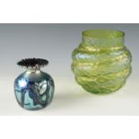 An early 20th Century loetz style iridescent green glass vase together with a Guernsey Island Studio