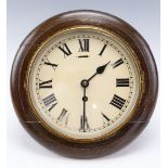 An early 20th Century oak-cased office dial clock, 29 cm