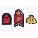 A post-1952 Welsh Guards colour sergeant's full dress rank badge together with two Royal Navy