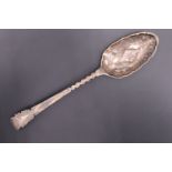 A Georgian / Victorian Old English pattern berry spoon, the handle having engraved and chased
