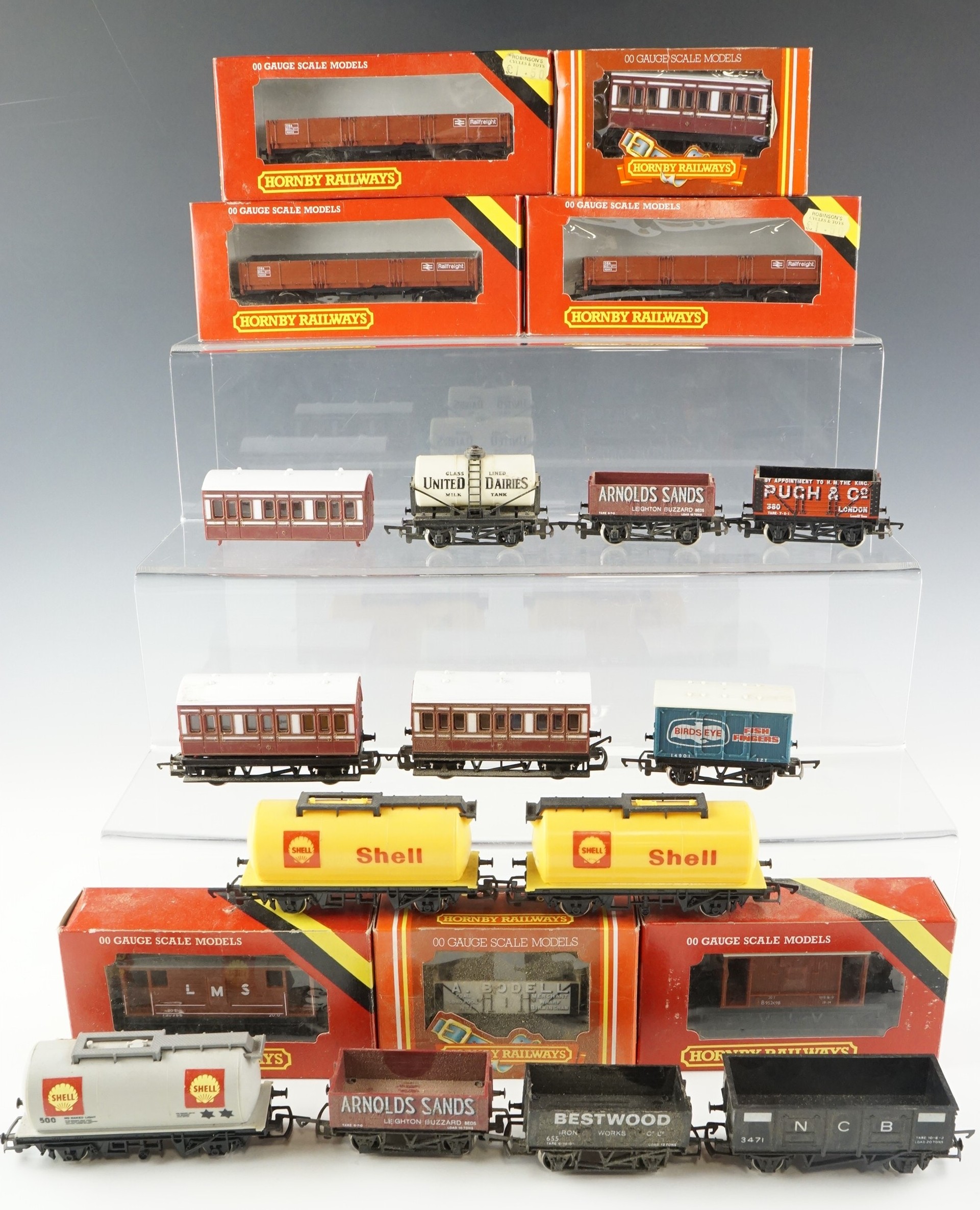A quantity of Hornby model railway rolling stock including shell tankers, brake vans, etc