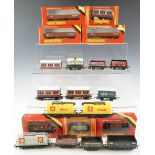 A quantity of Hornby model railway rolling stock including shell tankers, brake vans, etc