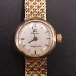 A 1960s Omega Ladymatic 9 ct gold wristlet watch, having a 24 jewel automatic movement, a silver