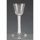 A mid 18th Century wine glass having an opaque twist and gauze tube stem, 15 cm