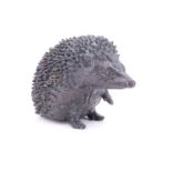 A small patinated cast bronze hedgehog, 3 cm high