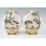 A pair of late 19th Century Royal Worcester Japanesque moon flasks, variously relief decorated