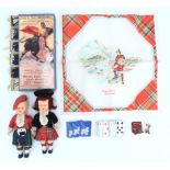 A group of kitsch Scottish tourist souvenirs together with a Spanish bullfighter matchstick box