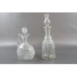 A Victorian facet cut decanter together with a claret jug, tallest 35 cm