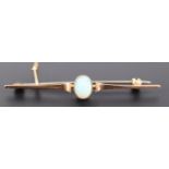 An early 20th Century opal and 9 ct yellow metal bar brooch, the oval cabochon of approx 8 mm x 6