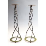 A pair of late 20th Century wrought iron stands having triple twisted helical stems, 75 cm tall