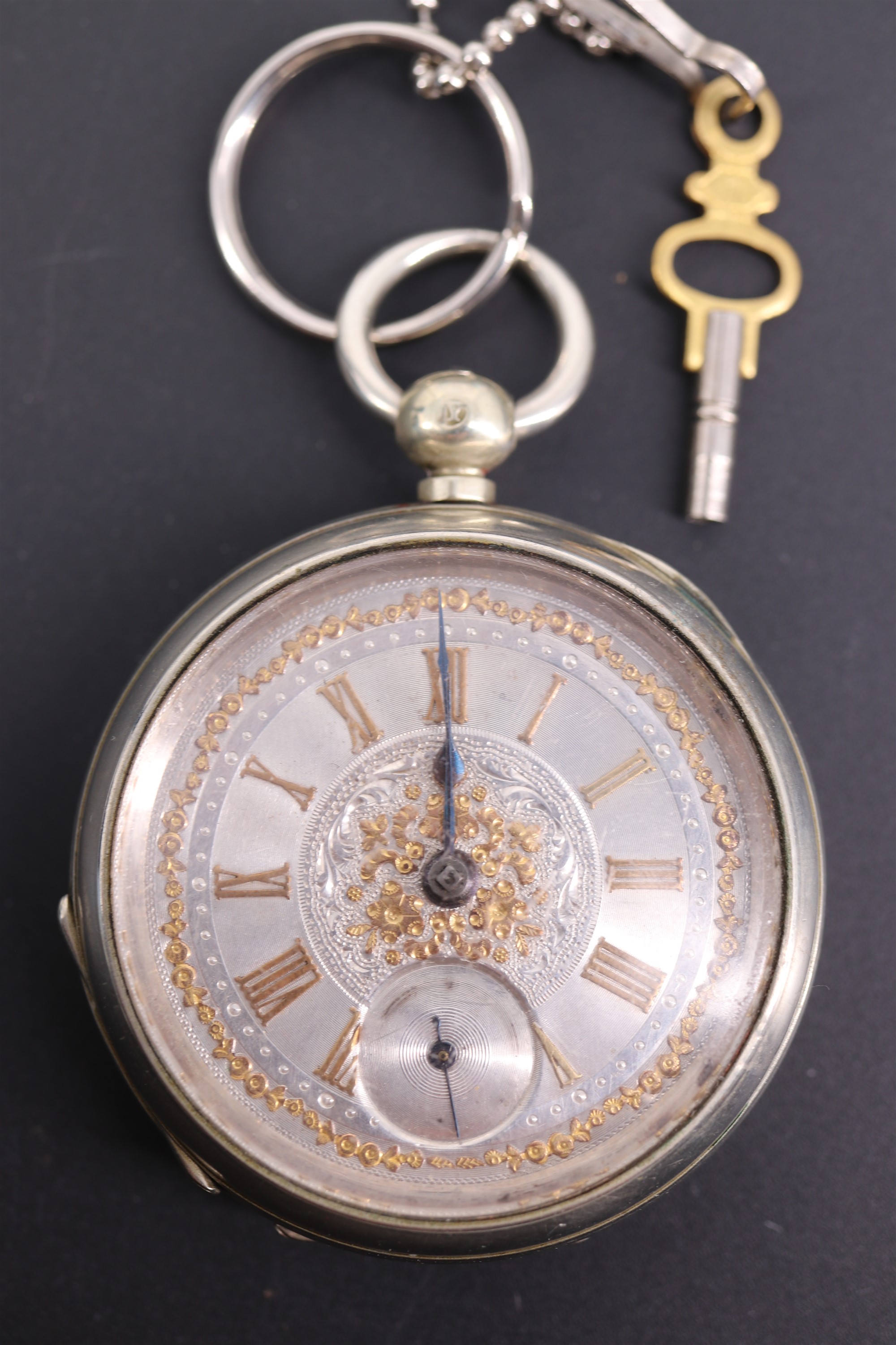 A Victorian nickel cased pocket watch, having a key wound lever movement, blued steel spade hands,