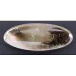 A silver-mounted candlesmoke lakeview on mother-of-pearl brooch by Maurice William Crawshaw, with