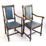 A pair of George V oak open armchairs, circa 1920s
