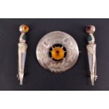 A Scottish silver and faux citrine plaid style brooch together with two polished hardstone and