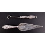 An early 20th Century silver bookmark, having a handle decorated with embossed scrolls, (partial