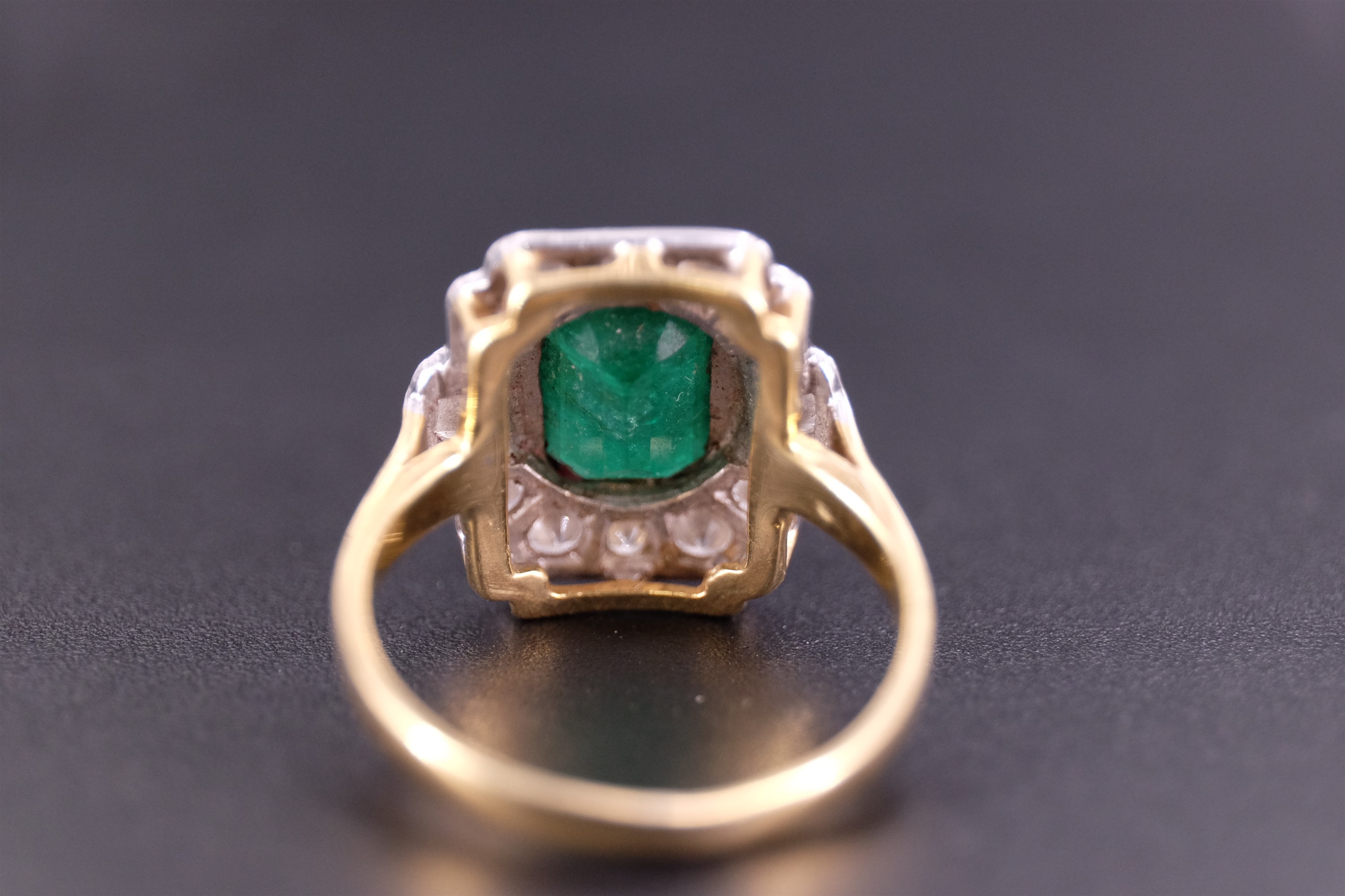 An Art Deco emerald and diamond ring, the central 'emerald' cut 1.75 carat emerald set in a yellow - Image 4 of 4