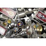 A large collection of enamelled silver plated, white metal and other souvenir teaspoons