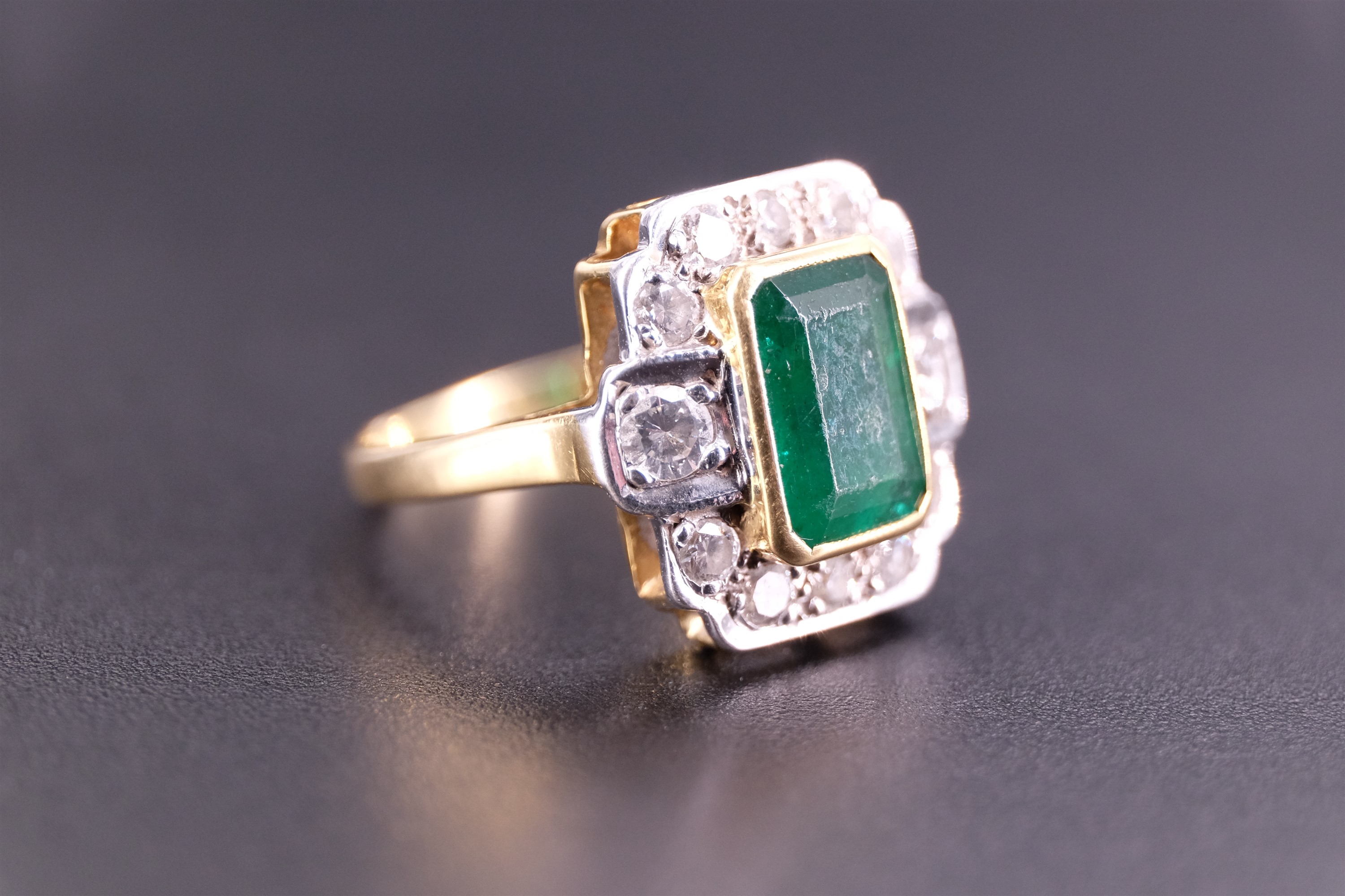 An Art Deco emerald and diamond ring, the central 'emerald' cut 1.75 carat emerald set in a yellow - Image 3 of 4