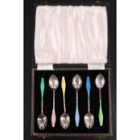 A cased set of six 1950s basse-taille harlequin enamelled silver teaspoons, having trailing ribbon