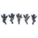 Five kitsch Baroque style bronzed resin wall-hanging cherub musicians, 14 cm