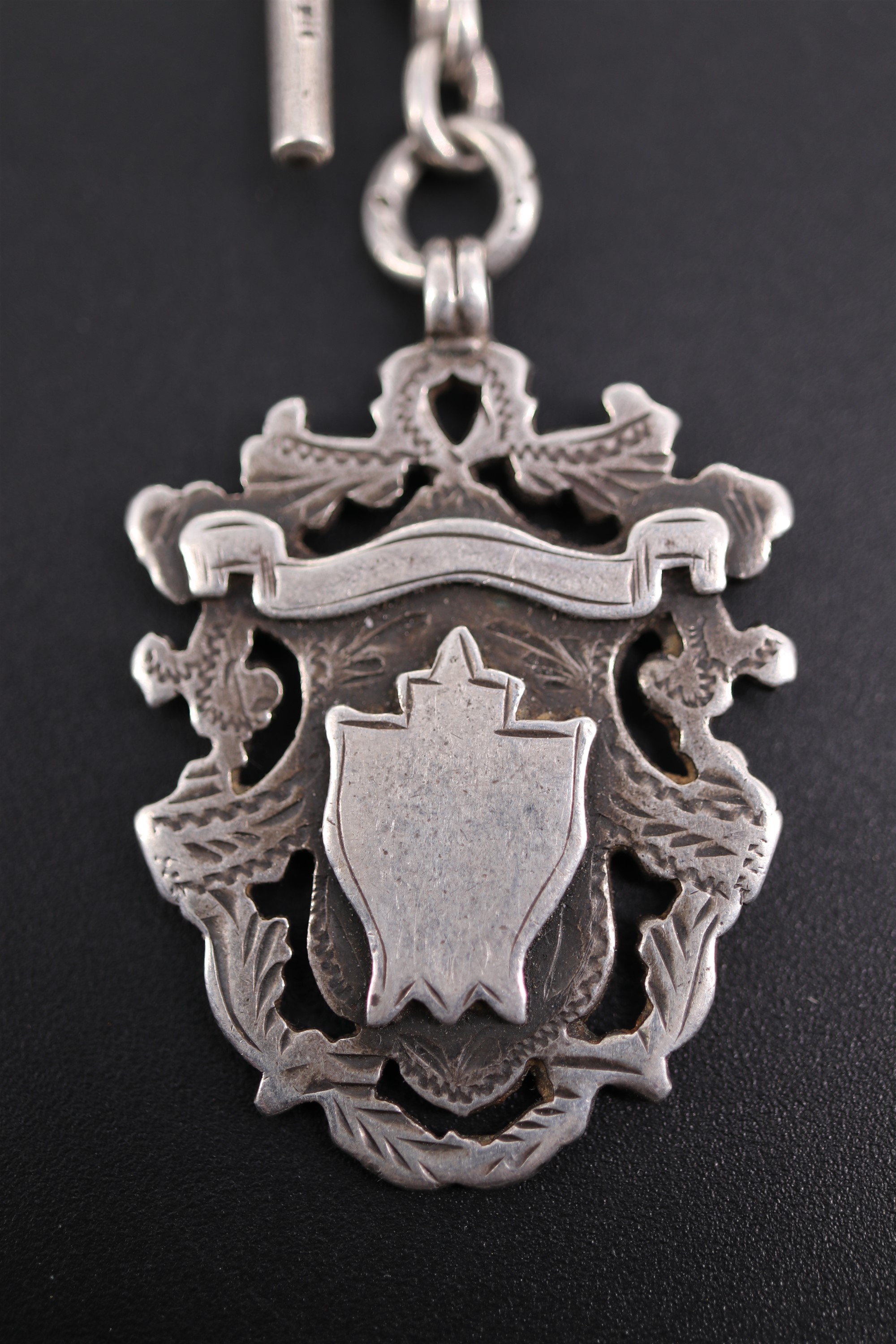 An Edwardian silver curb link double Albert watch chain with shield shaped fob medallion, 39 cm, - Image 2 of 5