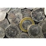 A group of commemorative GB fifty pence coins including Peter Rabbit, Sherlock Holmes, Sir Isaac