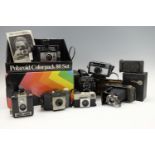 A group of vintage cameras, including a boxed Kodak "disc4000" and a "Duaflex", a "Brownie