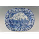 An early 19th Century underglaze blue ashet, decorated with a scene of fishermen on a river beside a