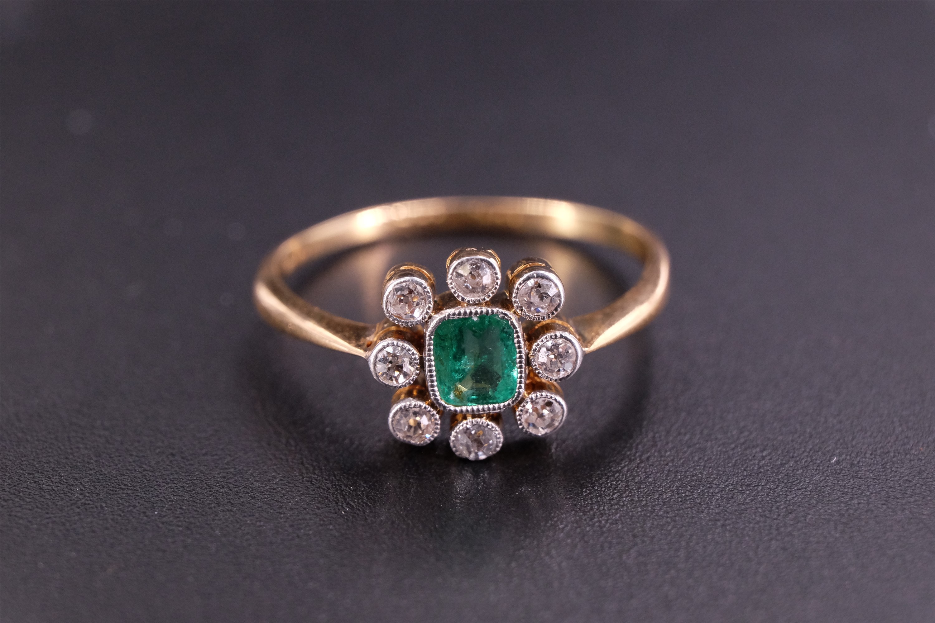 An early 20th Century emerald and diamond finger ring, comprising a central cushion-cut stone - Image 2 of 6