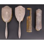 A 1930s silver-backed dressing table brush set, bearing engine turned decoration, (a/f)