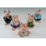 A set of five Wade piggy banks, having NatWest stoppers, tallest 18 cm