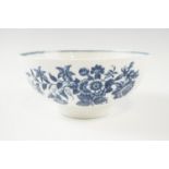 An 18th Century Worcester Three Flowers pattern blue-and-white bowl, decorated with flora and