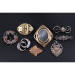 A small group of Victorian and early 20th Century costume jewellery including a rolled gold swivel