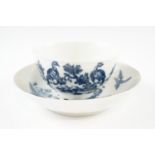 A 1775 - 1785 underglaze blue Worcester tea bowl and saucer in the Birds in the Branches pattern,