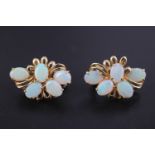 A pair of late 20th Century opal and 14 ct gold earrings, each comprising an asymmetric